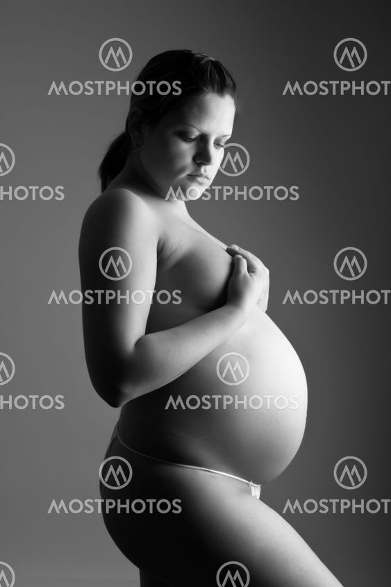 naken kvinna enorm gravid